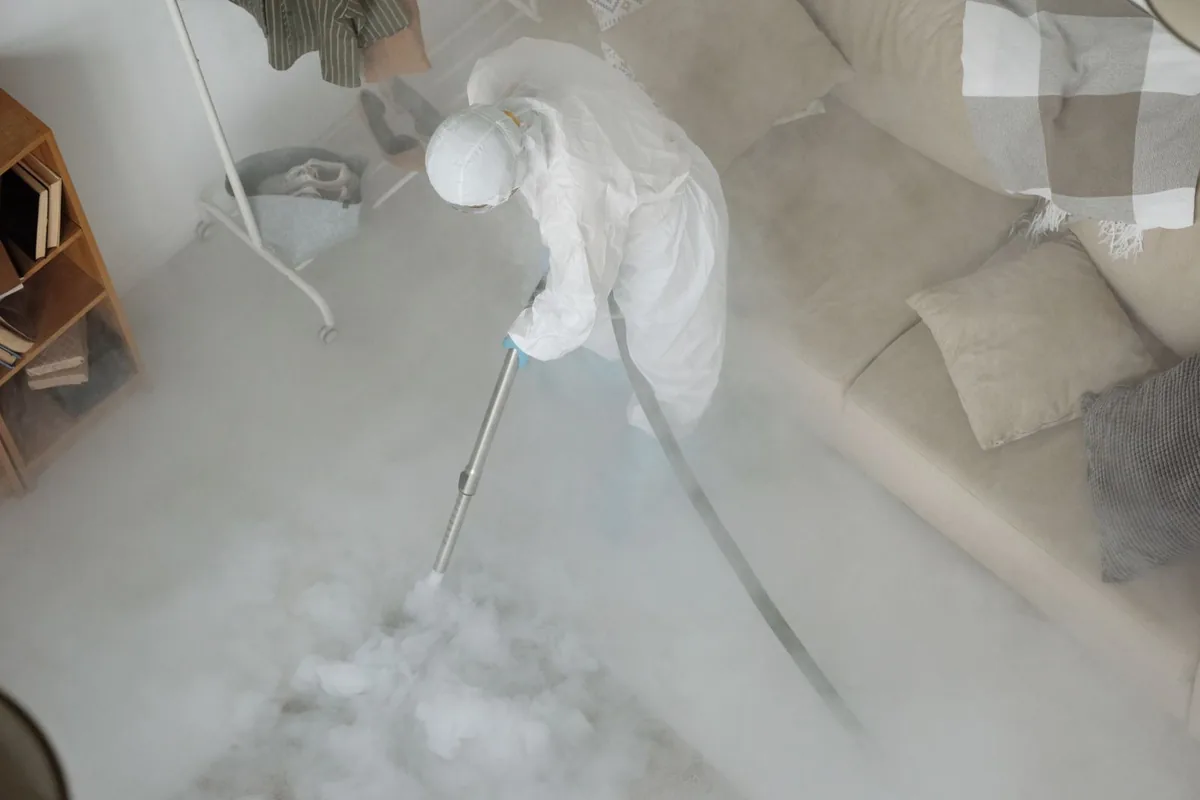 Biohazard cleanup technician in protective equipment, Portage, WI